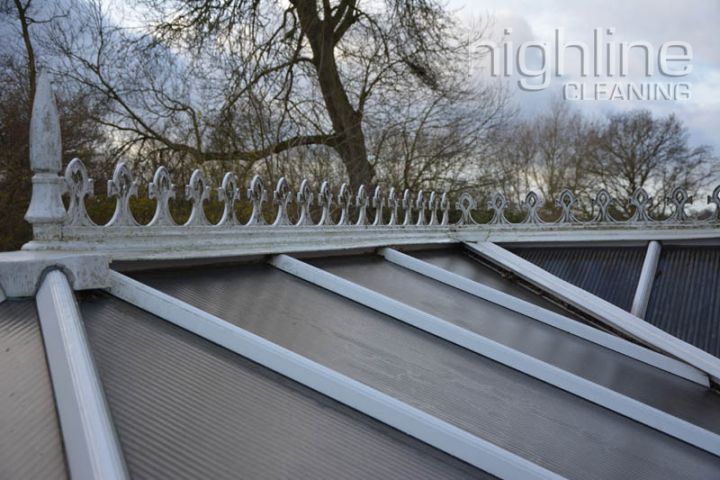 Highline Cleaning scrubbing a conservatory roof with soft brushes