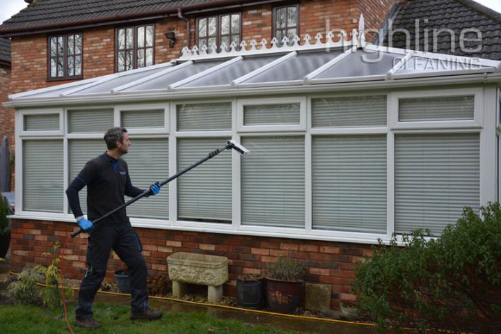 A Highline Cleaning franchisee at work with a water-fed pole