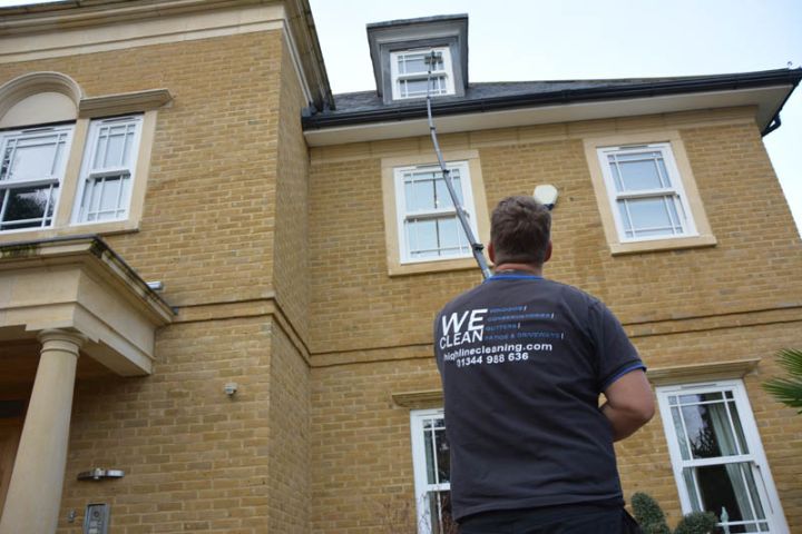 Highline Cleaning window cleaner cleaning the windows of a house