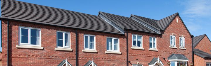 Clean white fascias and soffits along the roof line of a house