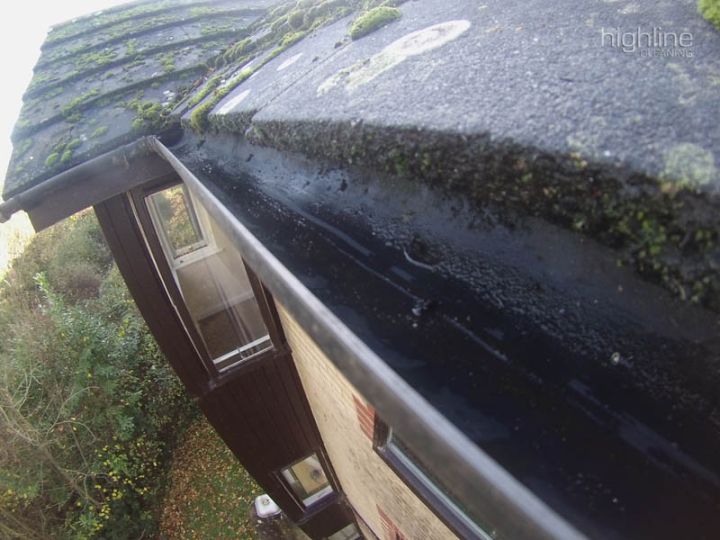 Clean gutters running along the roof of a house