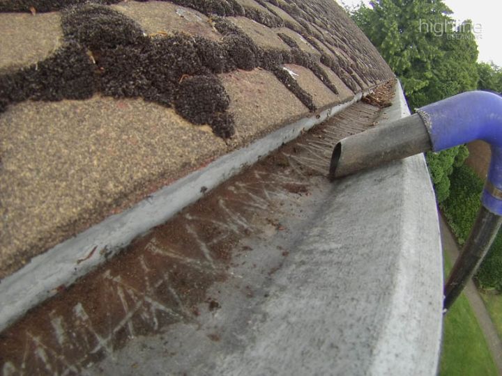Gutter cleaning on a house in Sunningdale